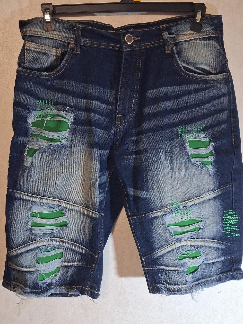 Men's Arketype denim distressed rips with green patchwork underneath. Size 36.